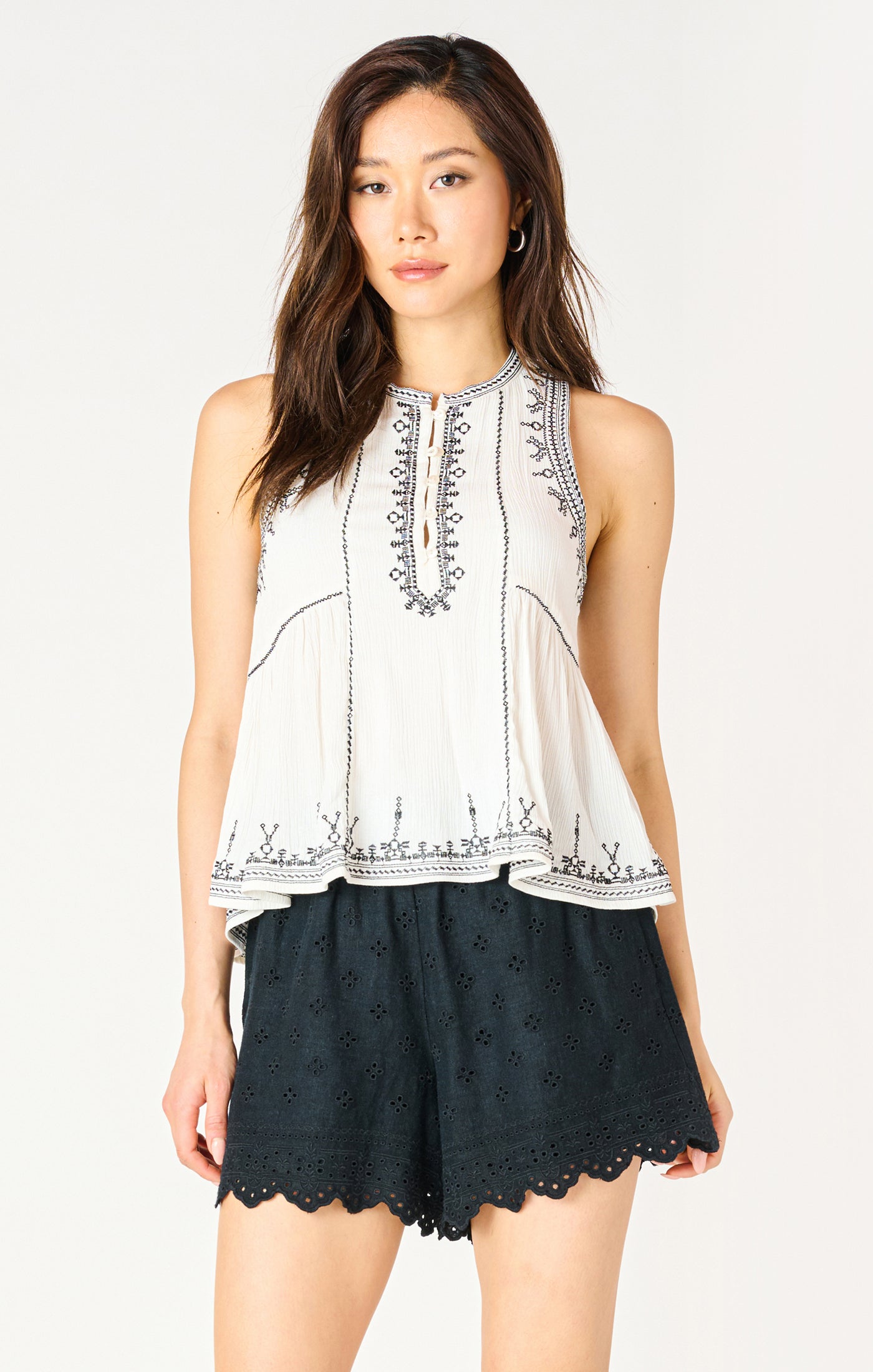 Embroidered Sleeveless Peplum Top