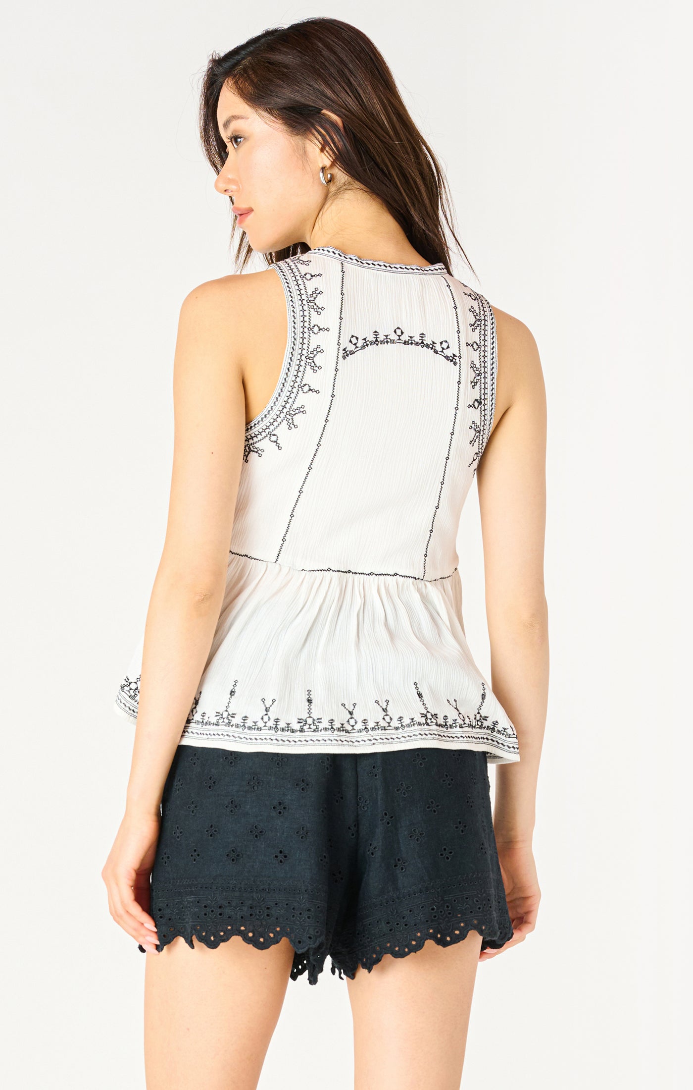 Embroidered Sleeveless Peplum Top